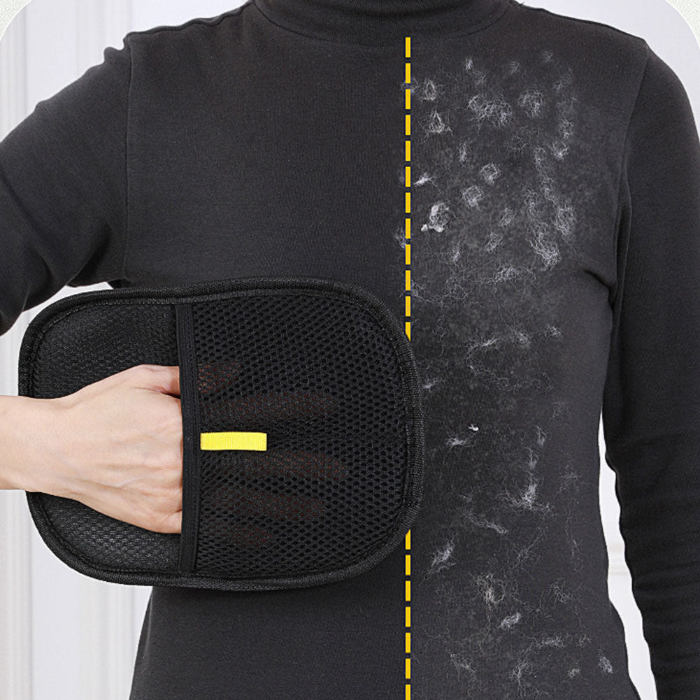 Glove held against a black jumper, one half covered in pet hair and the other half clean